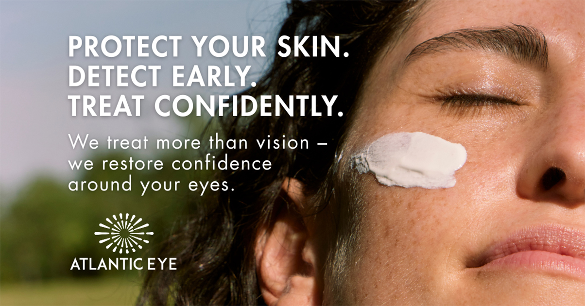 View of a woman's face with eyes closed showing sunblock skin cream under her eye area.